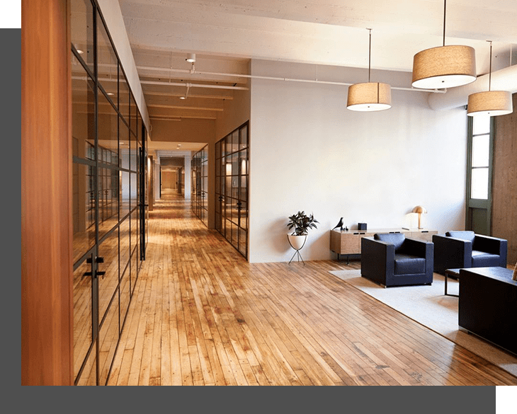 An image of an office with wooden floors and wooden walls.